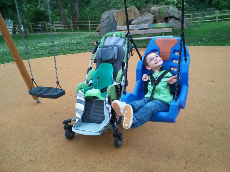 child in swing seat